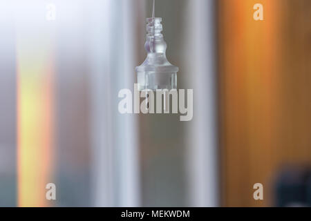 Electric plug on a blurred background hangs Stock Photo