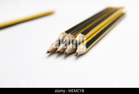 Black graphite pencils on white background. Students school supplies background . Office supplies. Selective focus. Write with pencil. Stock Photo