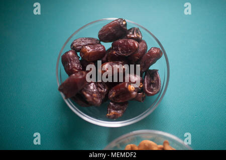 Dates in the Cup are on the table. Stock Photo