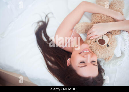 girl woke up in bed in the morning Stock Photo