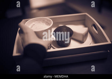 Woman's hand holding a Cup of coffee. Stock Photo