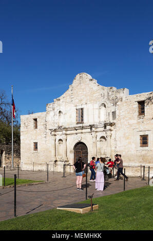USA tourists - tourists at the Alamo Mission on a sunny spring day in march, The Alamo, San Antonio, Texas USA Stock Photo