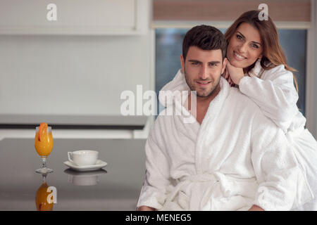 Portrait of a man and his wife in the kitchen while having breakfast Stock Photo