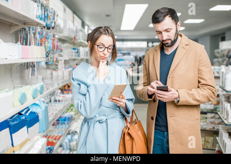 Couple in the pharmacy store Stock Photo