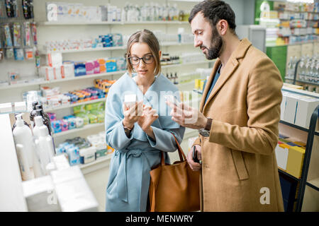 Couple in the pharmacy store Stock Photo