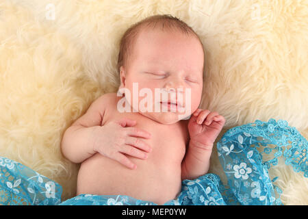 1 week old baby boy sleeping Stock Photo