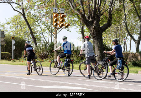 Alcudia, Majorca, Balearic Island, Spain, 2018. A group of cyclists wait at a traffic light on the outskirts of the historic town Stock Photo