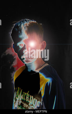 Mans face with single eye with an augmented graphical display emanating from his pupil Stock Photo