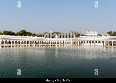 Sacred pond in front of the temple Gurudwara Bangla Sahib, Golden Temple in Delhi Stock Photo