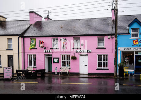 Sneem, Ireland - November 10, 2017: Picturesque and colorful houses and restaurants in the Ring of Kerry a rainy day. Stock Photo