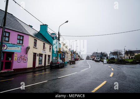 Sneem, Ireland - November 10, 2017: Picturesque and colorful houses and restaurants in the Ring of Kerry a rainy day. Stock Photo