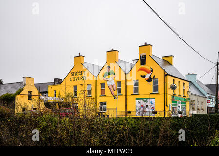 Sneem, Ireland - November 10, 2017: Picturesque and colorful houses and restaurants in the Ring of Kerry a rainy day. Stock Photo