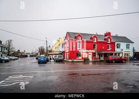 Sneem, Ireland - November 10, 2017: Picturesque and colorful houses and restaurants in the Ring of Kerry a rainy day. Stock Photo