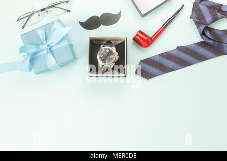 Table top view Happy Fathers day holiday background concept.Flat lay watch gift for dad with accessories objects sign of season on modern rustic blue  Stock Photo