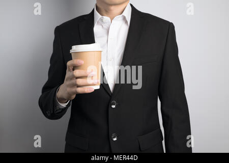business man holding a paper cup Stock Photo