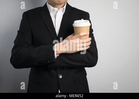 business man holding a paper cup Stock Photo