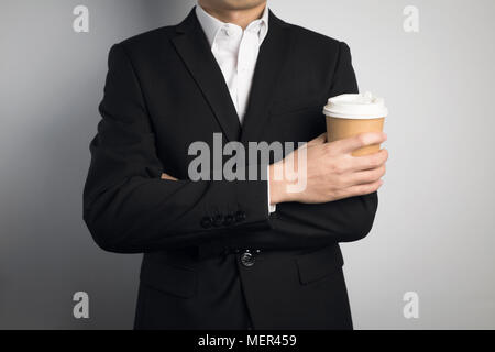business man holding a paper cup Stock Photo