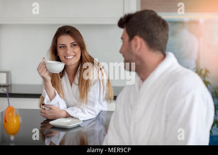 Portrait of a man and his wife in the kitchen while having breakfast