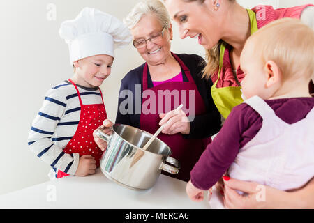 Family cooking in multigenerational household Stock Photo