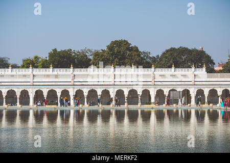Sacred pond in front of the temple Gurudwara Bangla Sahib, Golden Temple in Delhi Stock Photo