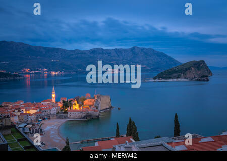 Dusk over the popular summer resort town Budva on the Adriatic coast in Montenegro Stock Photo