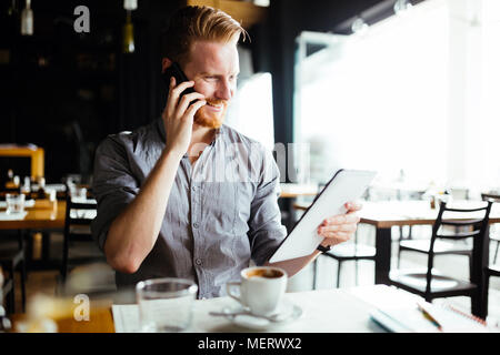 Businessman constantly working Stock Photo