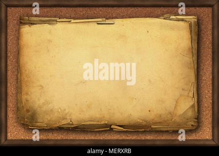 Yellowed pages of old paper on kork memo board. Space for message or picture. Stock Photo