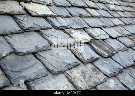 Aged weathered grey slate tile roof in Scotland UK Stock Photo