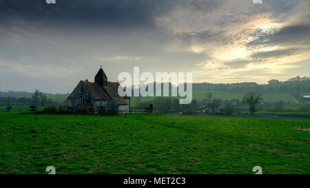 Spring evening light on St Hubert's chapel c1053 at Idsworth, South Downs, Hampshire, UK Stock Photo