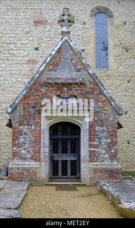 Spring view of St Mary's Church in Stoughton, West Sussex, UK Stock Photo