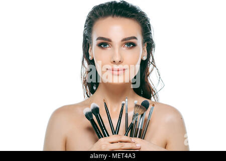 beauty woman face with make-up brushes Stock Photo