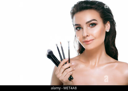 beauty woman face with make-up brushes Stock Photo