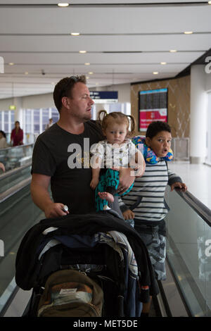 Dad travelling with infant at Airport Stock Photo