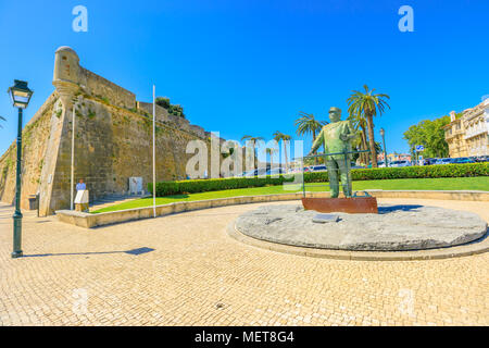 Cascais, Portugal - August 6, 2017: Statues in honor of King Carlos I near Fortress of Our Lady of Light along the harbor promenade in Cascais the most popular holiday destination on Lisbon coast. Stock Photo