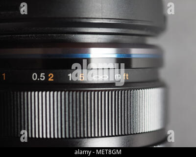 digital camera lens with detail of focus distance ring Stock Photo