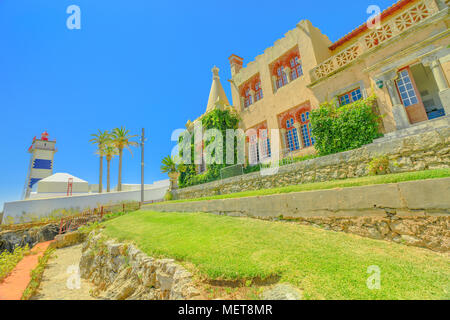 Perspective view of Santa Marta Lighthouse or Saint Martha's Lighthouse and House of Saint Mary or Casa de Santa Maria in Cascais, Atlantic coast, Portugal. Stock Photo