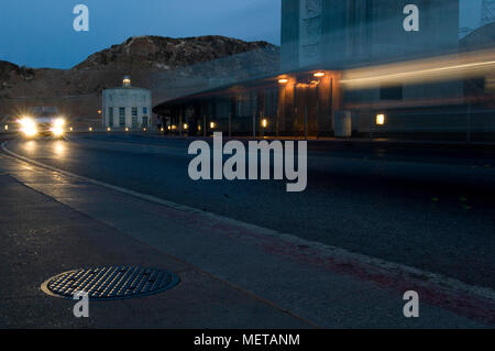 Motion blur of car headlights crossing the Nevada-Arizona border at Hoover Dam. Stock Photo