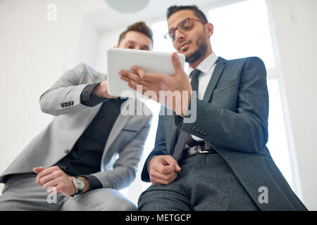 Multi-Ethnic Team Wrapped up in Work Stock Photo