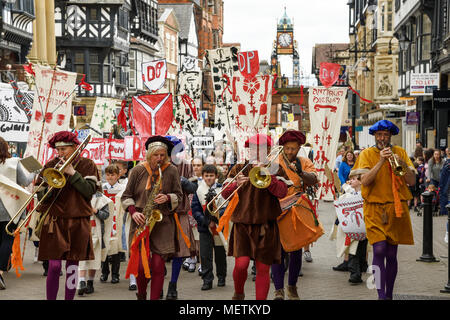 Chester, UK. 23rd April 2018. Musicians lead the St George's Day parade through Chester city centre. The parade includes street performance, theatre and music with local school children performing many supporting roles. Credit: Andrew Paterson/Alamy Live News Stock Photo