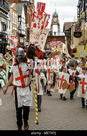 Chester, UK. 23rd April 2018. St George performs in the St George's Day parade through Chester city centre. The parade includes street performance, theatre and music with local school children performing many supporting roles. Credit: Andrew Paterson/Alamy Live News Stock Photo