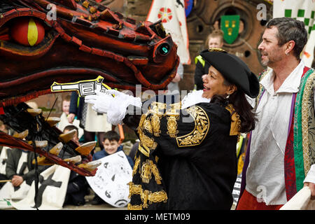 Chester, UK. 23rd April 2018. The Lady Mayor of Chester Razia Daniels slays the dragon at the end of the St George's Day parade through the city centre. The parade includes street performance, theatre and music with local school children performing many supporting roles. Credit: Andrew Paterson/Alamy Live News Stock Photo