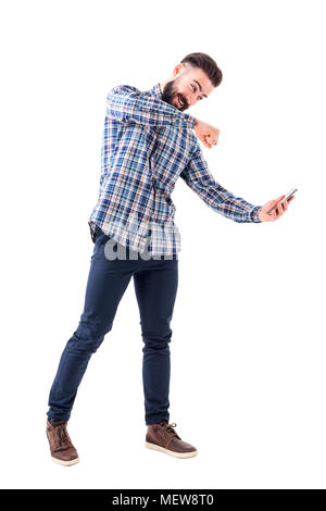 Angry bearded modern business man punching mobile phone screen. Rage concept. Full body isolated on white background. Stock Photo