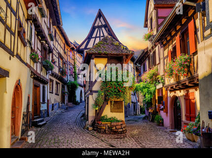Traditional colorful halt-timbered houses in Eguisheim Old Town on Alsace Wine Route, France Stock Photo