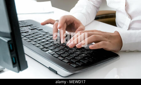 Closeup photo of young businesswoman working on computer Stock Photo