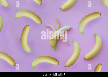Fresh yellow bananas on pink background Stock Photo