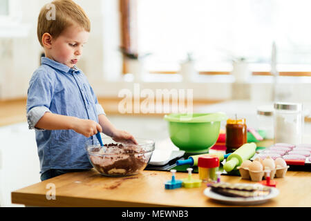 Cute child learning to become a chef Stock Photo