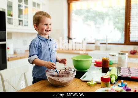 Cute child learning to become a chef Stock Photo