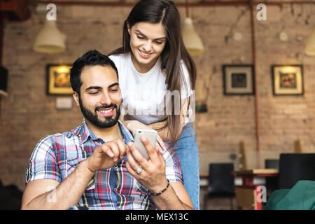 Playing Games on Smartphone Stock Photo