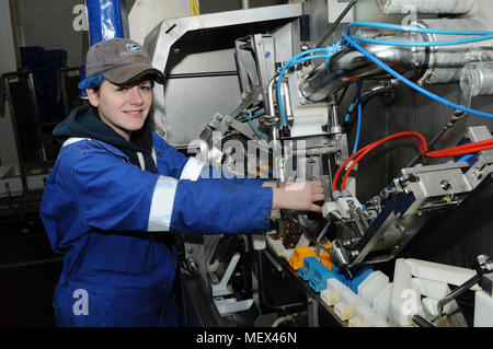 Female mechanical engineer working on machinery Stock Photo