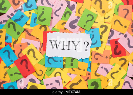 colourful paper note with question mark and white paper with word WHY. why concept background Stock Photo